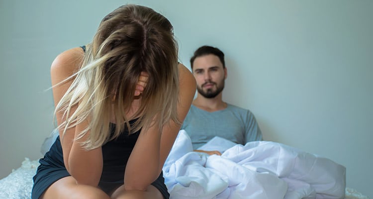 Couple having problems in relationship due to infidelity, on the bed
