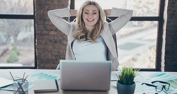 Beautiful business lady looking laptop