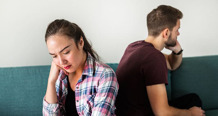 Unhappy couple not talking to one another