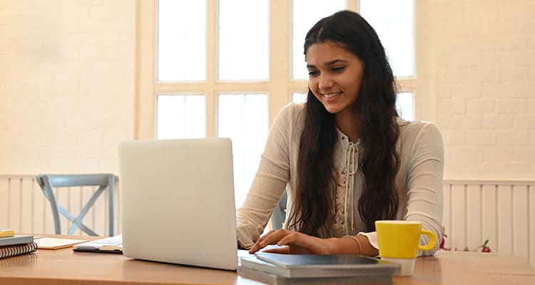 Smiling pretty woman working in office