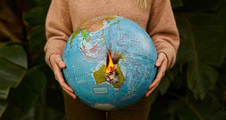 Woman holding burning globe