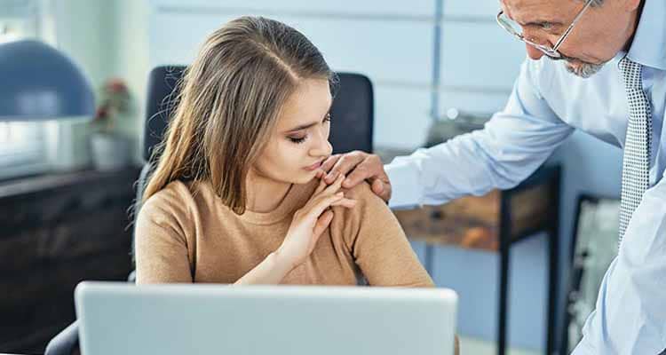 Boss touching female employee