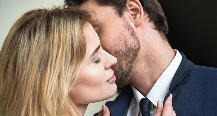 Man kissing woman