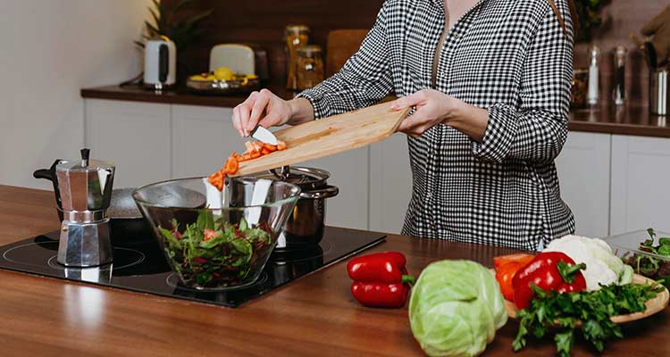 Woman preparing food in kitchen