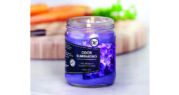 candle in self care gift basket